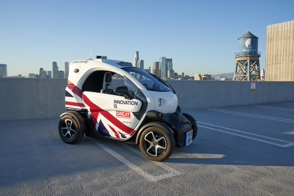 StreetDrone Twizy on a Los Angeles rooftop in Union Jack Livery, overlooking the city