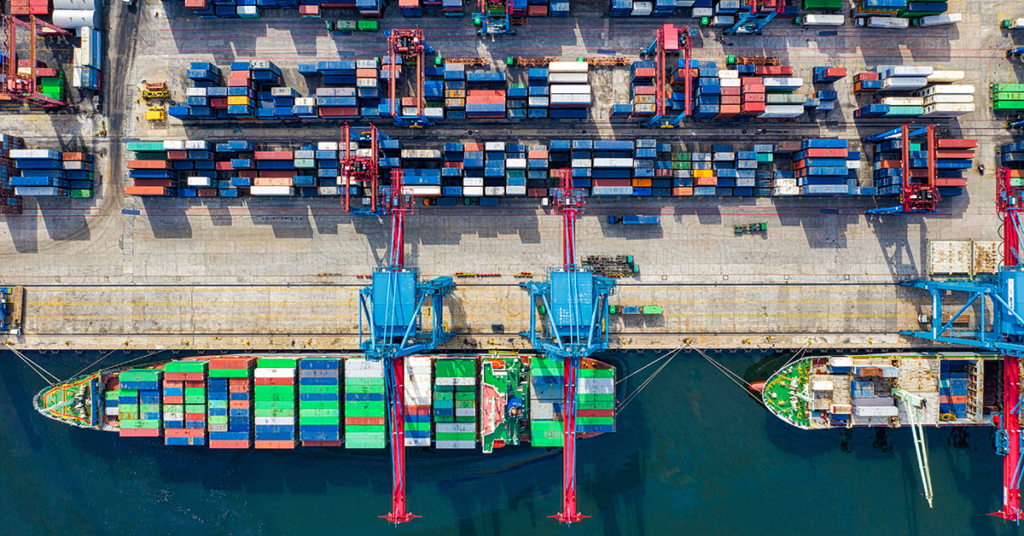 Aerial view shot of a shipping container boat in a port