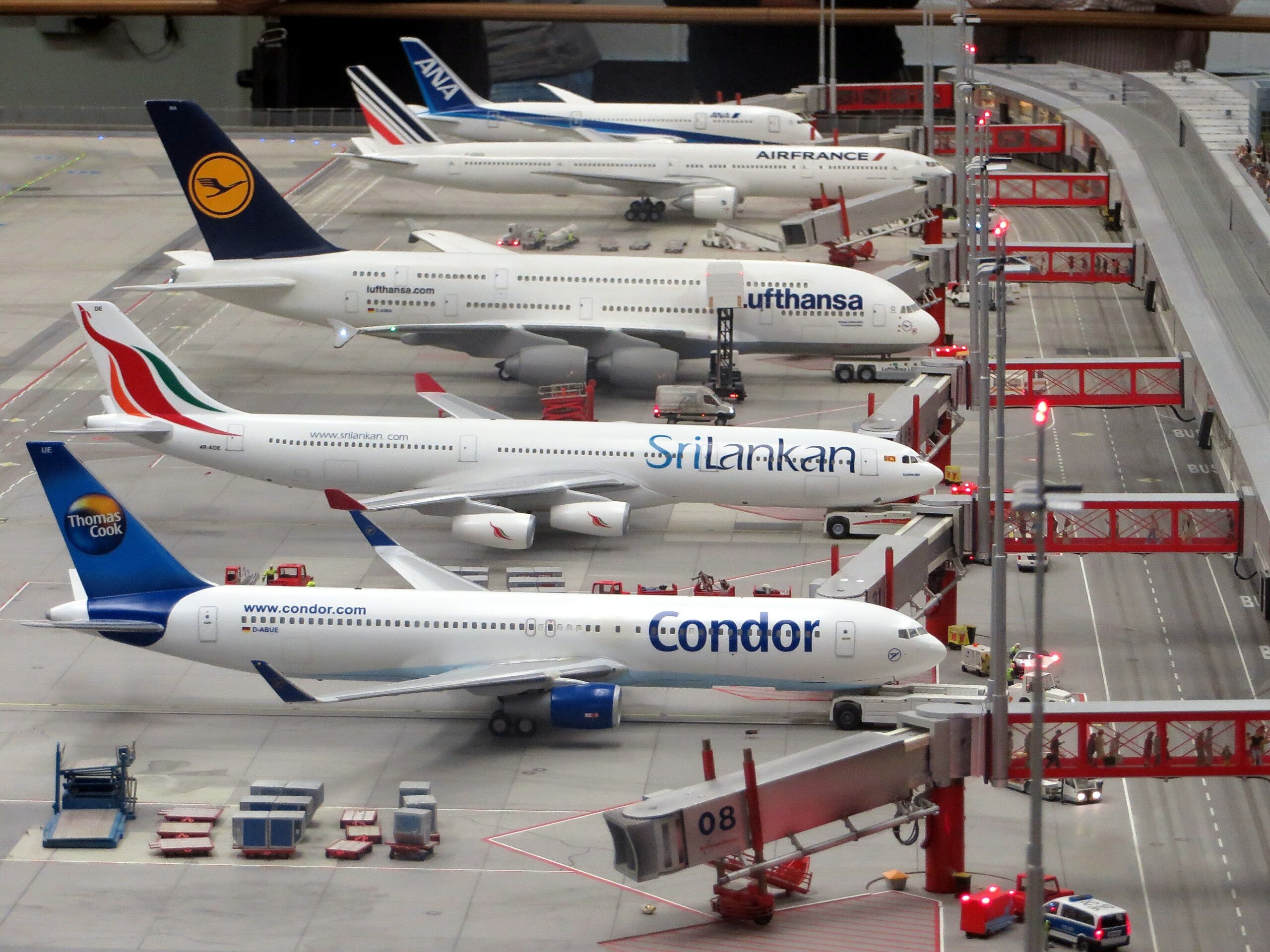 Different airline airplanes lined up in airport Photo by Pixabay: https://www.pexels.com/photo/condor-airplane-on-grey-concrete-airport-163792/