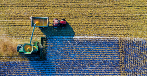 Aerial view of agriculture vehicle in a field Photo by Tom Fisk: https://www.pexels.com/photo/top-view-of-green-field-1595104/